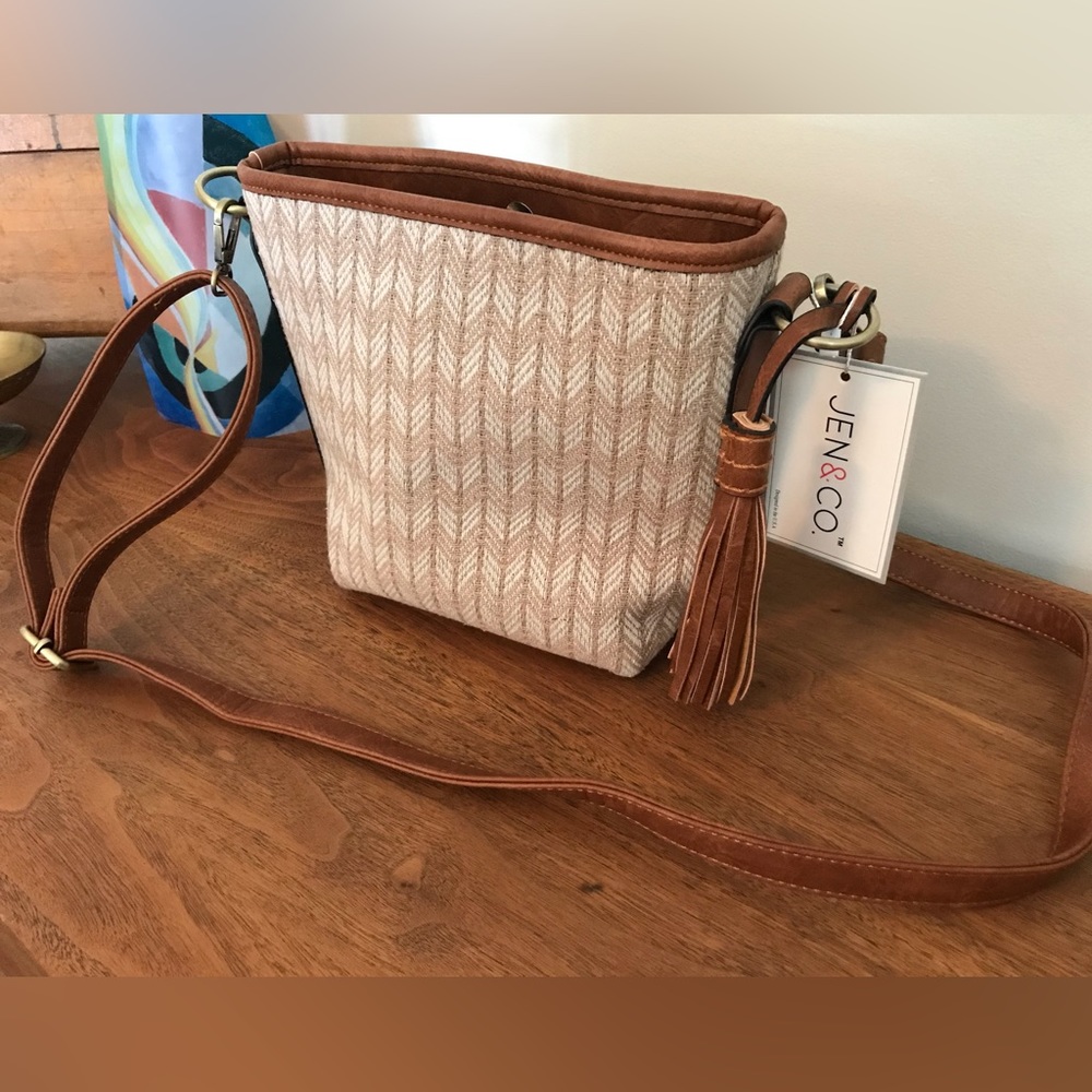 Light summer purse with adjustable strap. NWT